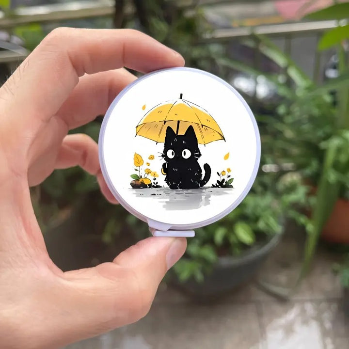 Ruban à mesurer chat sous la pluie