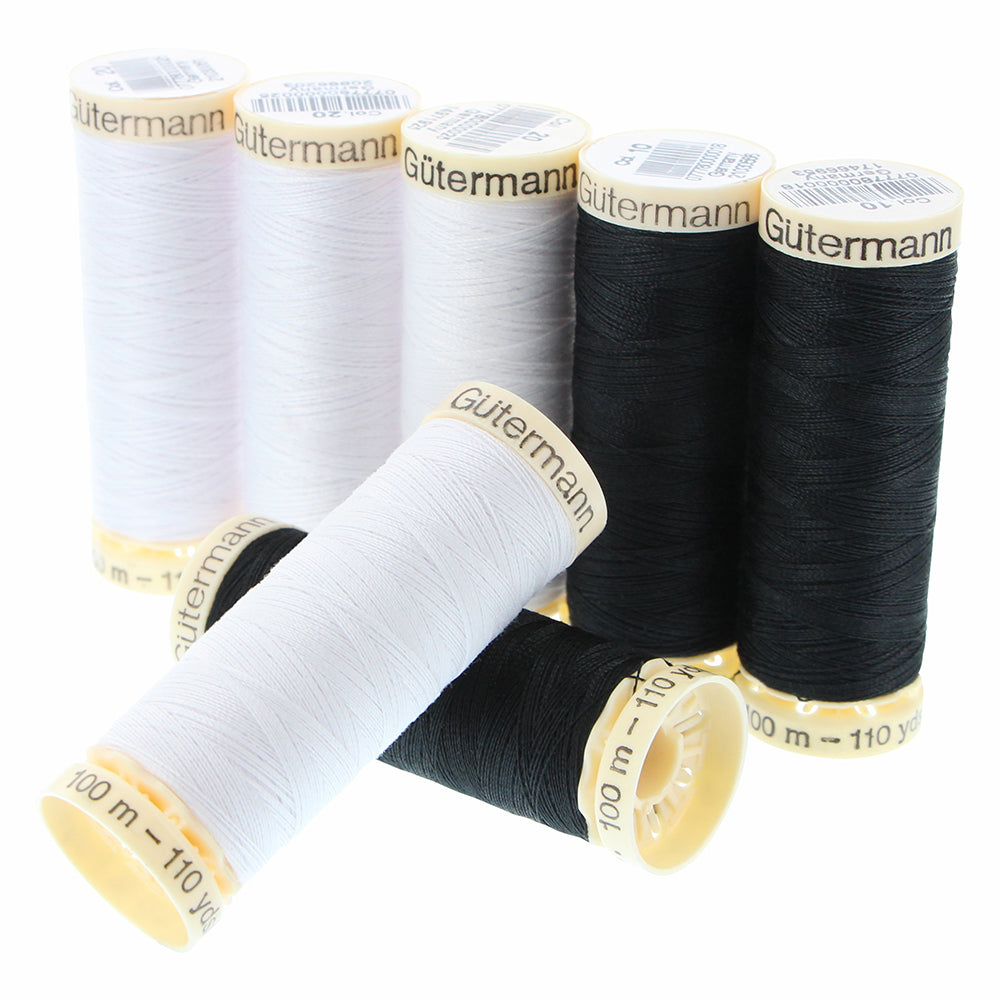 Ensemble de 7 mcx de fil à coudre MCT 100m - noir et blanc